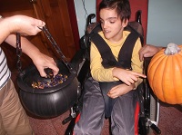 Francesco choosing the pumpkin, but is curious on what is inside the bowl!